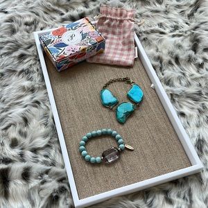 Plunder, teal bracelet, lol gold medaling one with a gemstone